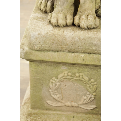 677 - A PAIR OF MODERN COMPOSITE STONE LIONS in seated position raised on square plinth bases (92cm high)