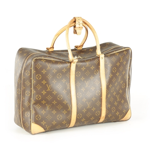 681 - A GENUINE LOUIS VUITTON SIRIUS TRAVEL BAG, with leather straps and monogrammed decoration. (43cm wid... 