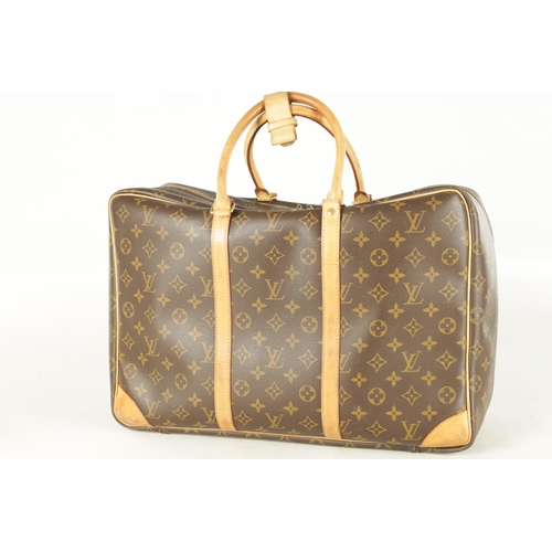 681 - A GENUINE LOUIS VUITTON SIRIUS TRAVEL BAG, with leather straps and monogrammed decoration. (43cm wid... 