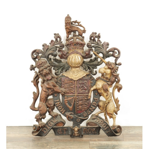 682 - A 19TH CENTURY CAST IRON ROYAL COAT OF ARMS with painted polychrome decoration (64cm wide 81cm high ... 