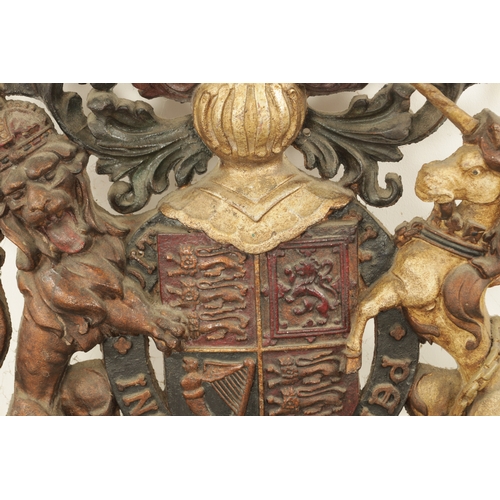 682 - A 19TH CENTURY CAST IRON ROYAL COAT OF ARMS with painted polychrome decoration (64cm wide 81cm high ... 