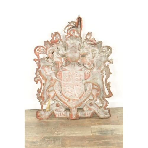 682 - A 19TH CENTURY CAST IRON ROYAL COAT OF ARMS with painted polychrome decoration (64cm wide 81cm high ... 