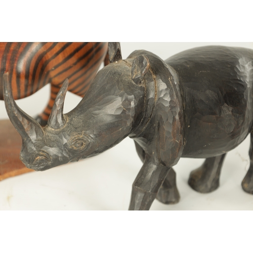 685 - A COLLECTION OF CARVED AFRICAN ANIMALS comprising of a water buffalo, an elephant, zebra and a rhino... 