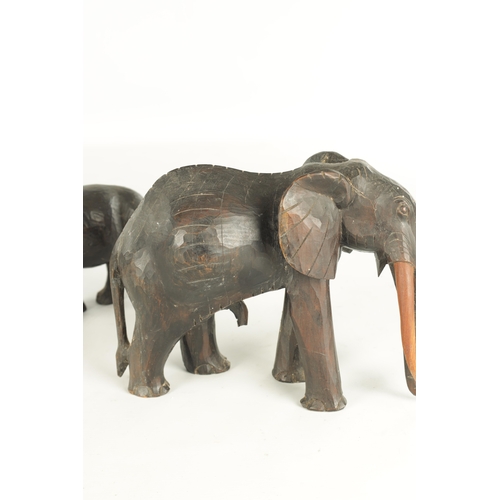 685 - A COLLECTION OF CARVED AFRICAN ANIMALS comprising of a water buffalo, an elephant, zebra and a rhino... 