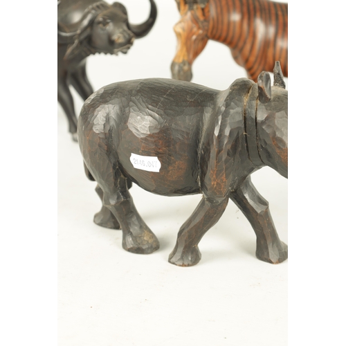 685 - A COLLECTION OF CARVED AFRICAN ANIMALS comprising of a water buffalo, an elephant, zebra and a rhino... 