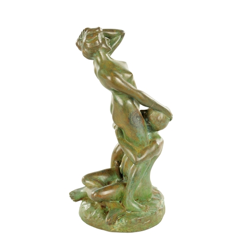 686 - A 20TH CENTURY FRENCH GREEN-PATINATED EROTIC BRONZE SCULPTURE depicting lovers (24cm high)