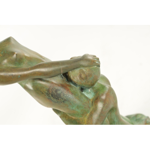 686 - A 20TH CENTURY FRENCH GREEN-PATINATED EROTIC BRONZE SCULPTURE depicting lovers (24cm high)