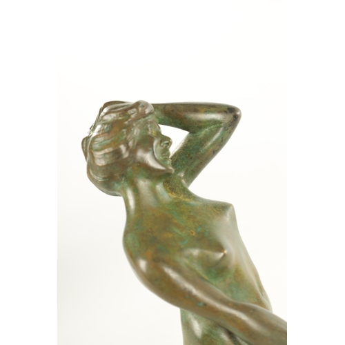 686 - A 20TH CENTURY FRENCH GREEN-PATINATED EROTIC BRONZE SCULPTURE depicting lovers (24cm high)