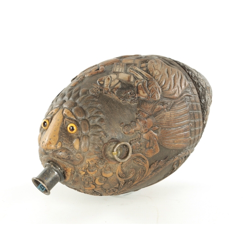 687 - AN EARLY 19TH CENTURY CARVED COCONUT BUGBEAR FLASK, in carved relief decoration depicting lady justi... 