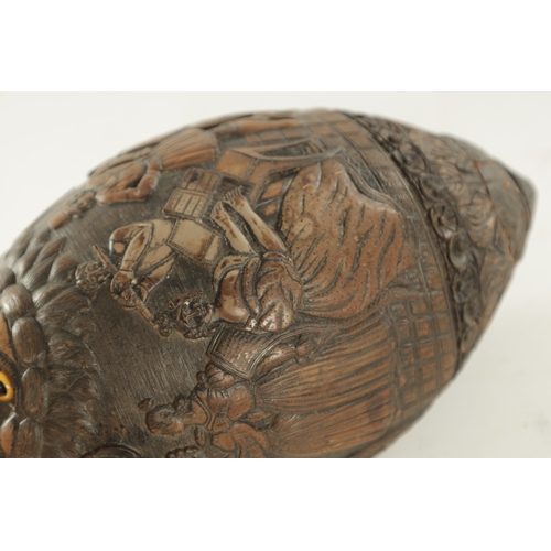 687 - AN EARLY 19TH CENTURY CARVED COCONUT BUGBEAR FLASK, in carved relief decoration depicting lady justi... 