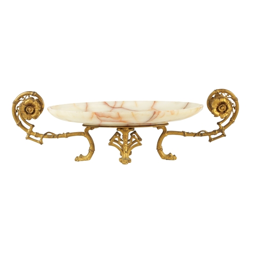 691 - A LATE 19TH CENTURY FRENCH GILT ORMOLU AND VEINED WHITE ONYX TAZZA OF AESTHETIC DESIGN with bamboo o... 