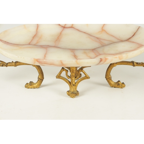 691 - A LATE 19TH CENTURY FRENCH GILT ORMOLU AND VEINED WHITE ONYX TAZZA OF AESTHETIC DESIGN with bamboo o... 