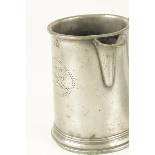 693 - AN ARTS AND CRAFTS PEWTER EWER with embossed leaf work sides TOGETHER WITH A GEORGIAN PEWTER QUART B... 