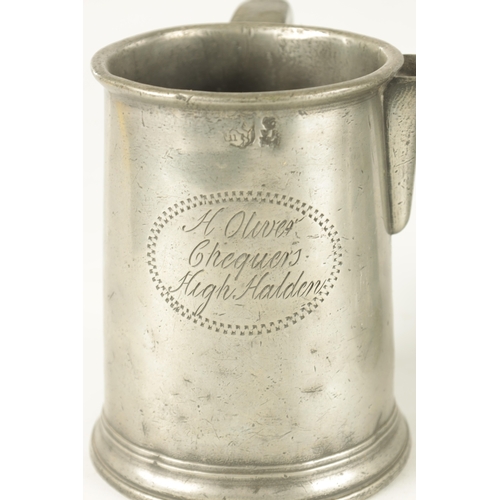 693 - AN ARTS AND CRAFTS PEWTER EWER with embossed leaf work sides TOGETHER WITH A GEORGIAN PEWTER QUART B... 