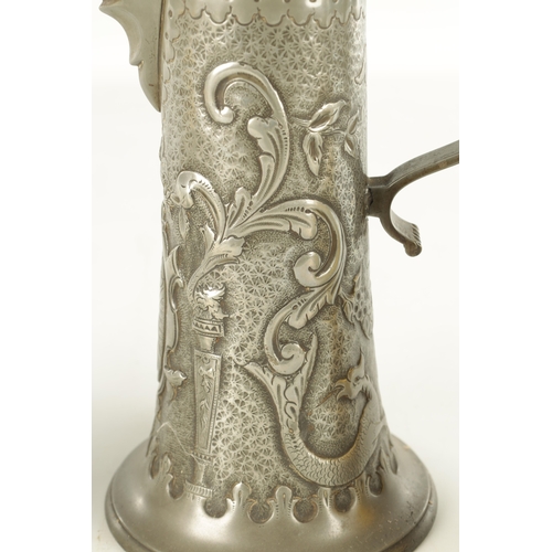 693 - AN ARTS AND CRAFTS PEWTER EWER with embossed leaf work sides TOGETHER WITH A GEORGIAN PEWTER QUART B... 