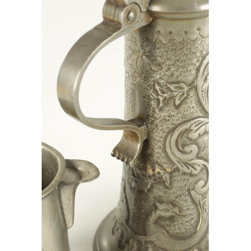 693 - AN ARTS AND CRAFTS PEWTER EWER with embossed leaf work sides TOGETHER WITH A GEORGIAN PEWTER QUART B... 