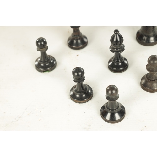 694 - A COLLECTION OF VARIOUS 19TH CENTURY BOXWOOD AND EBONISED CHESS PIECES in a pine box (King measures ... 