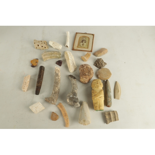 697 - A COLLECTION OF ANTIQUE RELICS comprising of bones, a lead mask, carved stone mark and mummy. (mummy... 