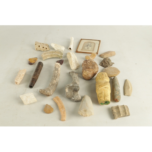 697 - A COLLECTION OF ANTIQUE RELICS comprising of bones, a lead mask, carved stone mark and mummy. (mummy... 