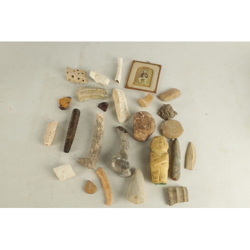 697 - A COLLECTION OF ANTIQUE RELICS comprising of bones, a lead mask, carved stone mark and mummy. (mummy... 