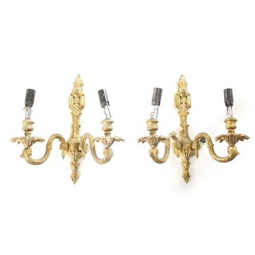 701 - A PAIR OF 20TH CENTURY GILT BRASS WALL LIGHTS with two leaf cast branches (31cm overall )