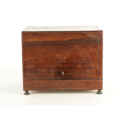 702 - A LATE 19TH CENTURY ROSEWOOD LIQUOR DECANTER BOX with a strung body, locking hinged lid and fold-dow... 