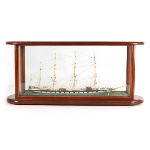 703 - A 19TH CENTURY SAILOR MADE CASED MODEL OF A FOUR MASTED SCHOONER SHIP, with bone masts and painted w... 