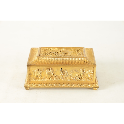 707 - A LATE 19TH CENTURY FRENCH GILT METAL JEWELLERY CASKET with classical figural scenes raised on bun f... 