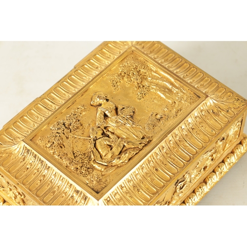 707 - A LATE 19TH CENTURY FRENCH GILT METAL JEWELLERY CASKET with classical figural scenes raised on bun f... 