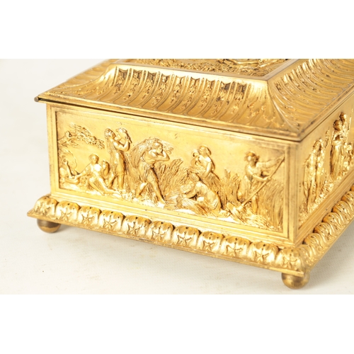 707 - A LATE 19TH CENTURY FRENCH GILT METAL JEWELLERY CASKET with classical figural scenes raised on bun f... 