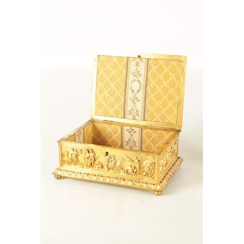 707 - A LATE 19TH CENTURY FRENCH GILT METAL JEWELLERY CASKET with classical figural scenes raised on bun f... 