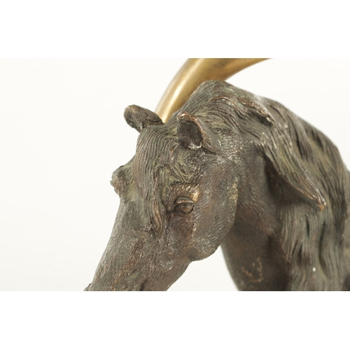 709 - A 19TH CENTURY FRENCH CAST BRONZE DOORSTOP FORMED AS A HORSE'S HEAD with a stirrup handle - signed t... 