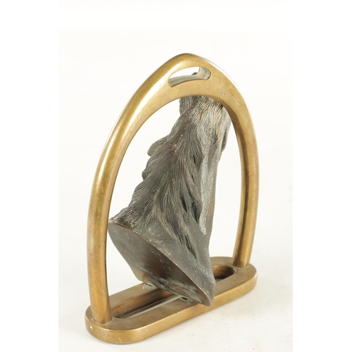 709 - A 19TH CENTURY FRENCH CAST BRONZE DOORSTOP FORMED AS A HORSE'S HEAD with a stirrup handle - signed t... 