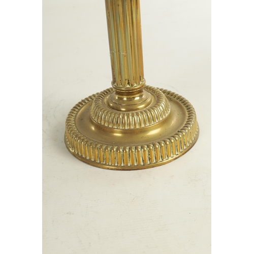 713 - A FINE VICTORIAN BRASS AND YELLOW GLASS OIL LAMP the stepped circular gadroon-edged base with reeded... 