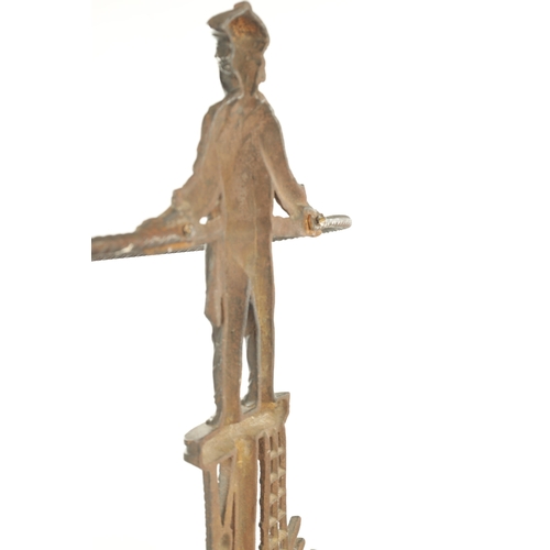 714 - A LATE 19TH CENTURY CAST IRON STICK STAND modelled as a sailor standing over an anchor and flags wit... 