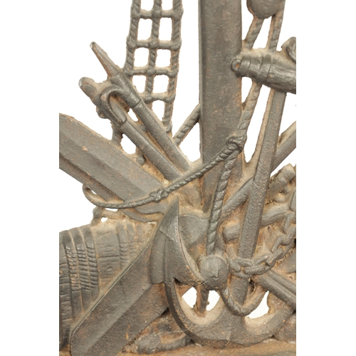 714 - A LATE 19TH CENTURY CAST IRON STICK STAND modelled as a sailor standing over an anchor and flags wit... 