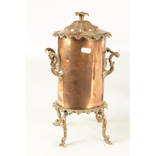 715 - A 19TH CENTURY COPPER CYLINDRICAL KETTLE with brass mounts and shaped legs (35cm high )