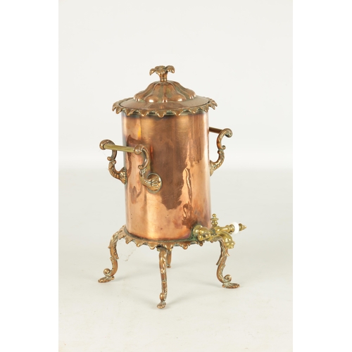 715 - A 19TH CENTURY COPPER CYLINDRICAL KETTLE with brass mounts and shaped legs (35cm high )