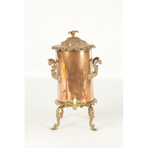 715 - A 19TH CENTURY COPPER CYLINDRICAL KETTLE with brass mounts and shaped legs (35cm high )