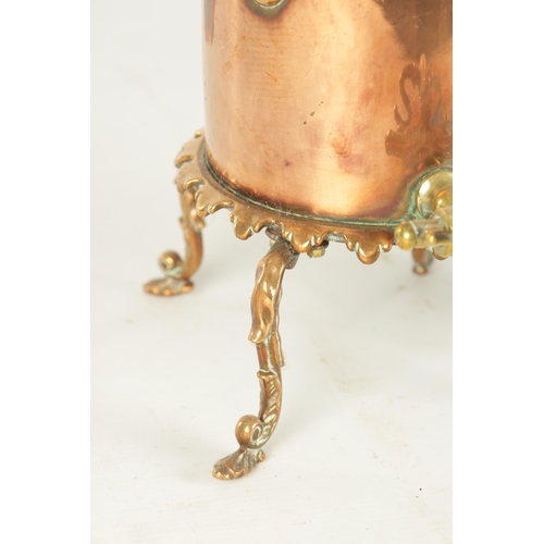 715 - A 19TH CENTURY COPPER CYLINDRICAL KETTLE with brass mounts and shaped legs (35cm high )