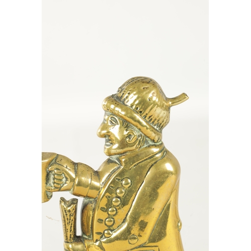 716 - TWO 19TH CENTURY BRASS DOORSTOPS, one modelled as a country gent with beer and staff, the other with... 