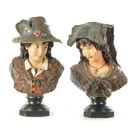 717 - A LARGE PAIR OF LATE 19TH CENTURY AUSTRIAN POLYCHROME PLASTER BUSTS modelled as a man and woman on s... 