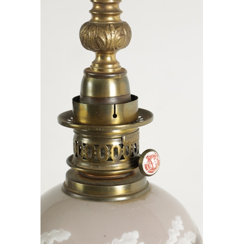 718 - A PAIR OF LATE 19TH CENTURY CAST GILT BRASS AND PORCELAIN OIL LAMPS CONVERTED FOR ELECTRICITY of ela... 