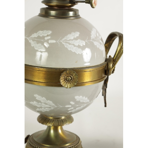 718 - A PAIR OF LATE 19TH CENTURY CAST GILT BRASS AND PORCELAIN OIL LAMPS CONVERTED FOR ELECTRICITY of ela... 