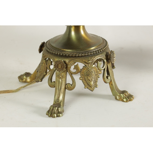 718 - A PAIR OF LATE 19TH CENTURY CAST GILT BRASS AND PORCELAIN OIL LAMPS CONVERTED FOR ELECTRICITY of ela... 