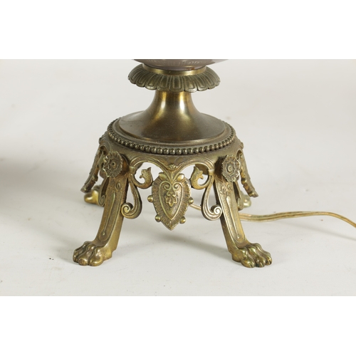 718 - A PAIR OF LATE 19TH CENTURY CAST GILT BRASS AND PORCELAIN OIL LAMPS CONVERTED FOR ELECTRICITY of ela... 