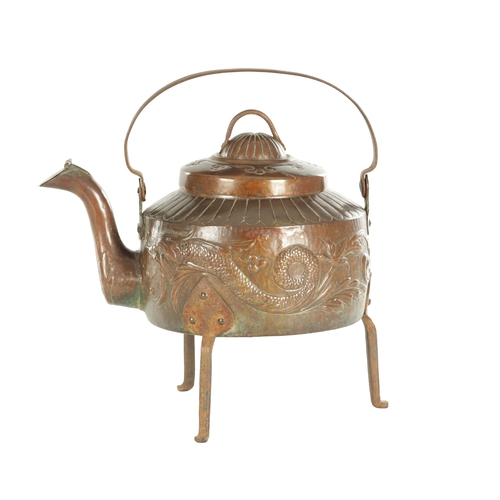 719 - A LARGE ARTS AND CRAFTS COPPER KETTLE with an iron-hinged handle and domed lid, the body decorated w... 