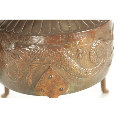 719 - A LARGE ARTS AND CRAFTS COPPER KETTLE with an iron-hinged handle and domed lid, the body decorated w... 