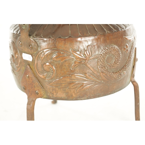 719 - A LARGE ARTS AND CRAFTS COPPER KETTLE with an iron-hinged handle and domed lid, the body decorated w... 