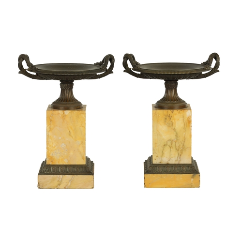 724 - A PAIR OF LATE 19TH CENTURY GRAND TOUR BRONZE AND SIENNA MARBLE TAZZAS with dished tops having serpe... 